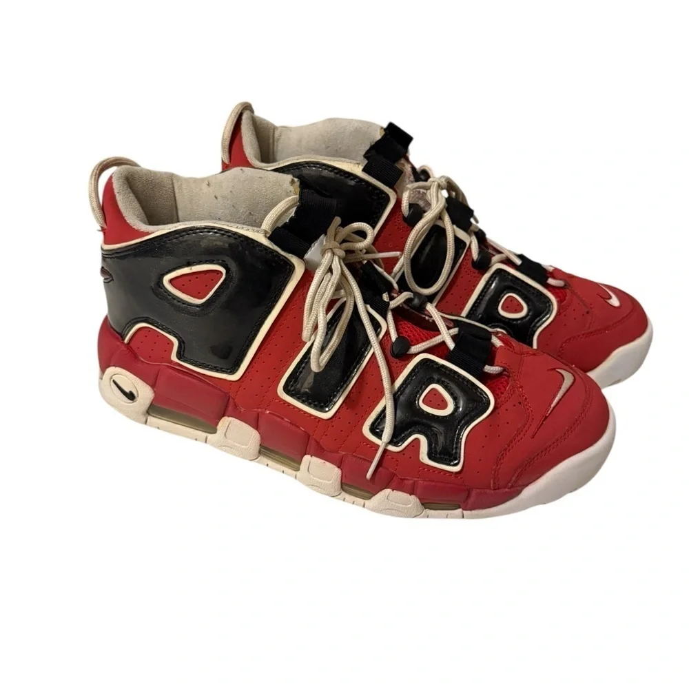 This is a pair of Nike Air More Uptempo '96 basketball shoes in a red, black.